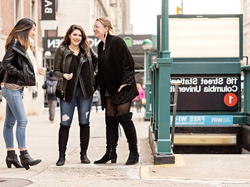 3 women outside the 116th st subway entrance